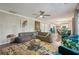 Spacious living room featuring hardwood floors with open access to kitchen and dining area at 135 Clubhouse Nw Dr, Kennesaw, GA 30144