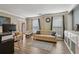 Living room with neutral walls, hardwood floors, and a comfortable seating arrangement at 135 Clubhouse Nw Dr, Kennesaw, GA 30144