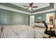 Spacious primary bedroom featuring a tray ceiling, carpeted floors, and a walk-in closet at 135 Clubhouse Nw Dr, Kennesaw, GA 30144