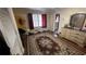 Bright bedroom with hardwood floor, dresser, closet, and a window with curtains at 1833 Stephenson Rd, Lithonia, GA 30058