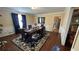 Dining room featuring hardwood floors, neutral walls with chair rail, and a dark wood dining table at 1833 Stephenson Rd, Lithonia, GA 30058