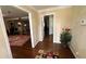 Inviting foyer with hardwood floors, a patterned rug, and views into the living and dining areas at 1833 Stephenson Rd, Lithonia, GA 30058