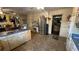 Traditional kitchen with stainless steel refrigerator, white cabinets, and tile floor at 1833 Stephenson Rd, Lithonia, GA 30058