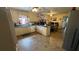 Spacious kitchen featuring tile floors, light wood cabinets, and a breakfast nook with lots of natural light at 1833 Stephenson Rd, Lithonia, GA 30058