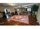 Spacious living room featuring hardwood floors, neutral walls, an oriental rug, and an open floor plan at 1833 Stephenson Rd, Lithonia, GA 30058
