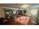 Spacious living room featuring hardwood floors, neutral walls, an oriental rug, and an open floor plan at 1833 Stephenson Rd, Lithonia, GA 30058