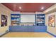 Basement with a media center, ample shelving, and a large screen for entertainment at 550 Atlanta Country Club Se Dr, Marietta, GA 30067