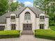 Charming exterior of a well-maintained home with symmetrical design and a lush green lawn at 550 Atlanta Country Club Se Dr, Marietta, GA 30067