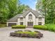 Elegant home featuring a beautiful stone driveway and well-manicured shrubs at 550 Atlanta Country Club Se Dr, Marietta, GA 30067
