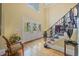 Elegant foyer featuring hardwood floors, stained-glass front doors, a staircase with iron railings, and high ceilings at 550 Atlanta Country Club Se Dr, Marietta, GA 30067