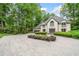Stately home featuring a circular driveway, well-manicured landscaping, and classic architectural details at 550 Atlanta Country Club Se Dr, Marietta, GA 30067