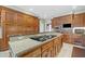 Gourmet kitchen with custom wood cabinetry, granite countertops, and modern appliances at 550 Atlanta Country Club Se Dr, Marietta, GA 30067