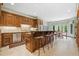 Gourmet kitchen with custom wood cabinetry, granite countertops, and a center island with bar seating at 550 Atlanta Country Club Se Dr, Marietta, GA 30067