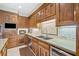 Beautiful kitchen featuring custom wood cabinetry, sleek countertops, and stainless steel appliances at 550 Atlanta Country Club Se Dr, Marietta, GA 30067