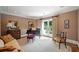 Cozy living room with neutral tones, French doors, a comfortable seating area, and classic decor at 550 Atlanta Country Club Se Dr, Marietta, GA 30067