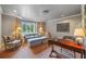 Inviting living room features bay window, soft seating, and decorative lighting at 550 Atlanta Country Club Se Dr, Marietta, GA 30067