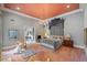 Luxurious primary bedroom with chandelier, sitting area, and decor at 550 Atlanta Country Club Se Dr, Marietta, GA 30067