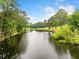 Scenic view of a calm pond surrounded by lush trees and greenery at 550 Atlanta Country Club Se Dr, Marietta, GA 30067