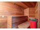 Wooden sauna interior with built-in benches and a heater for a relaxing spa experience at 550 Atlanta Country Club Se Dr, Marietta, GA 30067