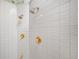 Tiled shower featuring two shower heads and ornate gold fixtures at 550 Atlanta Country Club Se Dr, Marietta, GA 30067