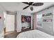 Bedroom with ceiling fan, pink curtains, window, closet, and white furniture at 607 Lexington Way, Woodstock, GA 30189