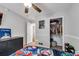 Bedroom with ceiling fan, closet, and dark dresser at 607 Lexington Way, Woodstock, GA 30189