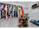 Walk-in closet with clothing racks, hanging clothes, and shoe racks at 607 Lexington Way, Woodstock, GA 30189
