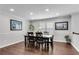 Bright dining room with hardwood floors, a chandelier, and natural light at 607 Lexington Way, Woodstock, GA 30189