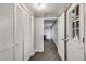 Bright hallway with storage closet leads to recreation area, featuring a pool table at 607 Lexington Way, Woodstock, GA 30189
