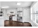 Modern kitchen with stainless steel appliances, white cabinets, and hardwood floors at 607 Lexington Way, Woodstock, GA 30189