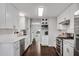 Stylish kitchen showcasing stainless steel appliances, bright countertops, and seamless design at 607 Lexington Way, Woodstock, GA 30189
