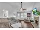 Comfortable living room with a stone fireplace, hardwood floors, and vaulted ceilings at 607 Lexington Way, Woodstock, GA 30189