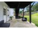Outdoor patio with furniture and landscaping provides a relaxing outdoor area at 607 Lexington Way, Woodstock, GA 30189