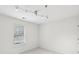 Bright bedroom with window and track lighting at 106 Weatherstone Square Drive, Woodstock, GA 30188