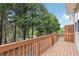 Inviting deck overlooking a wooded area, offering privacy and a serene outdoor space at 106 Weatherstone Square Drive, Woodstock, GA 30188