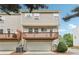 Townhouse boasts a private balcony, ground-floor garage, and appealing beige siding at 106 Weatherstone Square Drive, Woodstock, GA 30188