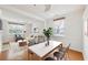Bright and airy living and dining area with hardwood floors and lots of natural light at 106 Weatherstone Square Drive, Woodstock, GA 30188