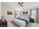 Tranquil main bedroom with neutral tones, a ceiling fan, and large windows at 106 Weatherstone Square Drive, Woodstock, GA 30188