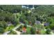 Aerial view of home surrounded by lush trees and neighborhood near the lake at 21 Picketts Ridge Ln, Acworth, GA 30101