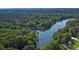 Stunning aerial view of the lake surrounded by lush greenery, providing a serene and natural backdrop at 21 Picketts Ridge Ln, Acworth, GA 30101