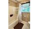 Bathroom with a shower/tub combo and a window providing natural light at 21 Picketts Ridge Ln, Acworth, GA 30101