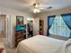 Bedroom featuring ample closet space and a ceiling fan for added comfort at 21 Picketts Ridge Ln, Acworth, GA 30101