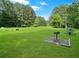 Expansive community green space featuring picnic tables, a grill and recreational amenities for residents' enjoyment at 21 Picketts Ridge Ln, Acworth, GA 30101
