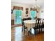 Formal dining room with hardwood floors, chandelier, and traditional decor provides an elegant space for entertaining at 21 Picketts Ridge Ln, Acworth, GA 30101