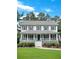 Charming two-story home featuring a large front porch, beautiful landscaping, and a welcoming atmosphere at 21 Picketts Ridge Ln, Acworth, GA 30101