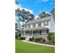 Charming two-story home featuring a large front porch, beautiful landscaping, and a welcoming atmosphere at 21 Picketts Ridge Ln, Acworth, GA 30101