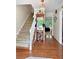 Bright foyer features hardwood floors, a staircase to the upper level, and views into the living spaces at 21 Picketts Ridge Ln, Acworth, GA 30101