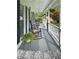 Relaxing front porch features rocking chairs, ceiling fans, and views of the manicured front lawn at 21 Picketts Ridge Ln, Acworth, GA 30101