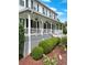 Inviting front porch with white railings, lattice trim, and meticulous landscaping at 21 Picketts Ridge Ln, Acworth, GA 30101