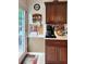 Well-organized kitchen area with rich wood cabinets, a coffee maker, and a cozy, functional design at 21 Picketts Ridge Ln, Acworth, GA 30101
